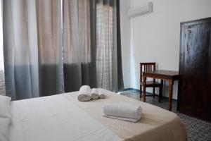 Postel nebo postele na pokoji v ubytování B&B Al Vecchio Pontile kitesurf