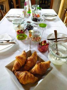 a table with a plate of pastries on a table at Duca Di Dolle in Rolle