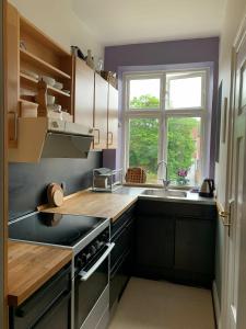a kitchen with a sink and a window at ApartmentInCopenhagen Apartment 308 in Copenhagen
