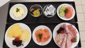 a tray filled with different types of food on plates at Schloß Wittgenstein in Bad Laasphe +17 photos