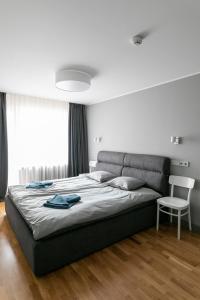 A bed or beds in a room at Brand New, Family-friendly with a great location - Moon Apartment