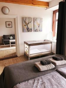 a bedroom with a bed with two pillows on it at Apartmán 2KK Sauna and Aromatherapy in Jihlava