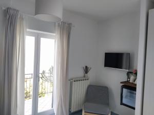 TV a/nebo společenská místnost v ubytování Judia Camere sul mare