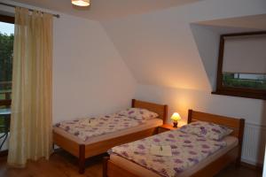 Tempat tidur dalam kamar di Słoneczna Ostoja