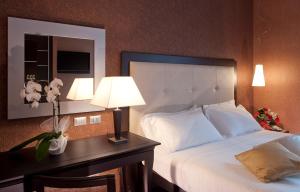 Letto o letti in una camera di c-hotels Fiume