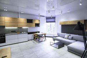 a living room with a couch and a table at Duke Apartments in Odesa