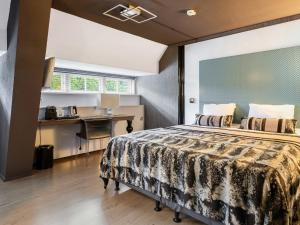 Un pat sau paturi într-o cameră la Hotel Woudschoten