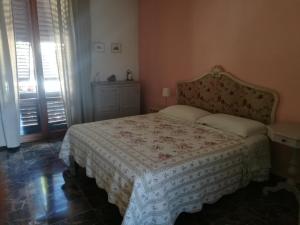 a small bedroom with a bed and a window at Intorno Firenze B&B in San Piero a Sieve