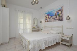 Ένα ή περισσότερα κρεβάτια σε δωμάτιο στο simos luxury apartments