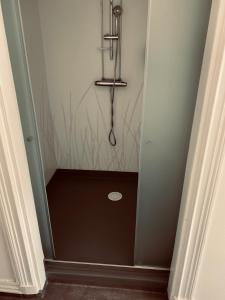 a walkway with a shower in a room at Stekhuset B&B in Kalmar