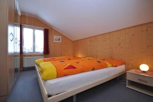 Postel nebo postele na pokoji v ubytování Chalet Bim Chilchli