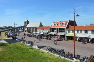 a street in a town with a group of people at Studio Zwin 9 in Zoutelande