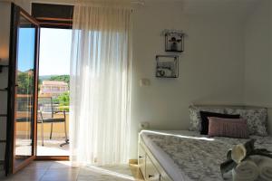 Postel nebo postele na pokoji v ubytování Iva Apartmani