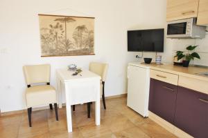 Kuchyň nebo kuchyňský kout v ubytování Iva Apartmani