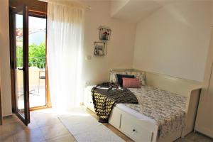 Postel nebo postele na pokoji v ubytování Iva Apartmani