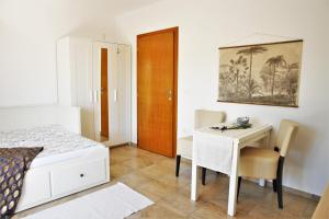 Postel nebo postele na pokoji v ubytování Iva Apartmani