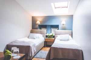 Posteľ alebo postele v izbe v ubytovaní Hotel Floryan Old Town