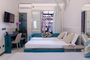 Postel nebo postele na pokoji v ubytování Hotel Grifo