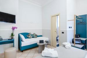 TV a/nebo společenská místnost v ubytování Hotel Grifo