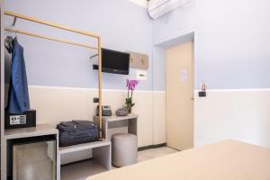 Postel nebo postele na pokoji v ubytování Hotel Grifo