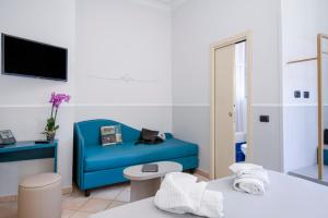 Postel nebo postele na pokoji v ubytování Hotel Grifo