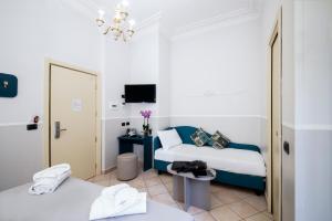 Postel nebo postele na pokoji v ubytování Hotel Grifo