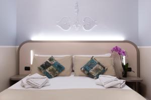 Postel nebo postele na pokoji v ubytování Hotel Grifo