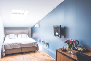Posteľ alebo postele v izbe v ubytovaní Hotel Floryan Old Town