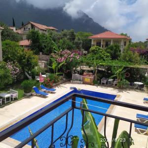 a view from the balcony of a resort with a mountain at CC's Butik Hotel in Oludeniz