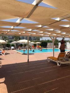 Swimming pool sa o malapit sa Mythical Sands Resort Ilona Apartment for families