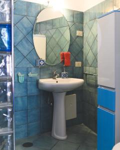 a bathroom with a sink and a mirror at Parco Augusto in Capri