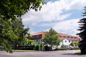 a street in front of a building at Wyndham Garden Potsdam in Potsdam