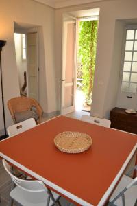a table with a hat sitting on top of it at AI RONCHI apts in Cannero Riviera