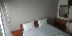 Postel nebo postele na pokoji v ubytování GR Apartments Sea View