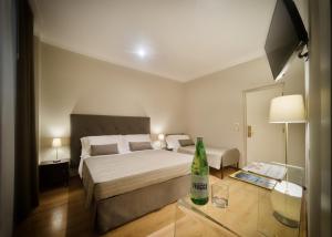 Postel nebo postele na pokoji v ubytování Hotel Touring Wellness & Beauty