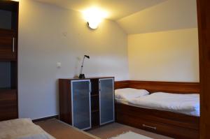 Postel nebo postele na pokoji v ubytování Apartmán G4 v Tatranskej Štrbe - Apartmánový dom Golem