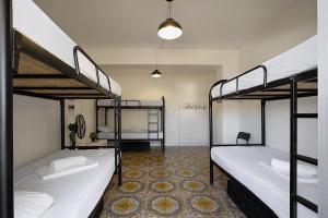 Postel nebo postele na pokoji v ubytování White Hostel
