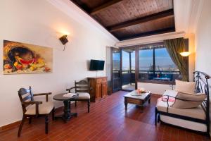 a living room with a couch and a table at Kallisti Hotel in Potos