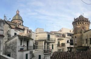 a group of buildings with domes on top of them at MACALELU HOUSE in Vietri sul Mare