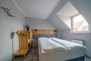 Una cama o camas en una habitación de Duett - Urban Rooms
