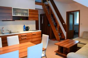 Kuchyň nebo kuchyňský kout v ubytování Apartmán G4 v Tatranskej Štrbe - Apartmánový dom Golem + 7 fotografií