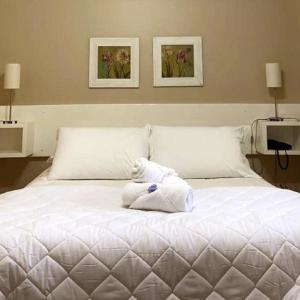 Cama ou camas em um quarto em Verona Parque Hotel