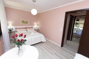 Cama ou camas em um quarto em Verona Parque Hotel