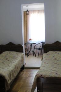 Voodi või voodid majutusasutuse Guest house Racha toas