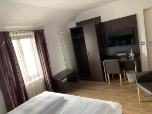 Postel nebo postele na pokoji v ubytování Hotel Seeluna am Klostersee