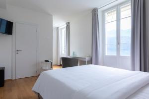 Postel nebo postele na pokoji v ubytování Lac Hotel