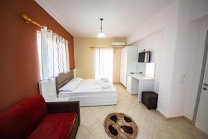 Postel nebo postele na pokoji v ubytování Ideal ApartHotel Saranda