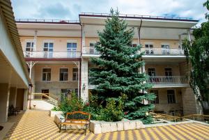 a christmas tree in the courtyard of a building at Pyatigorskaya Klinika Sanatorium in Pyatigorsk