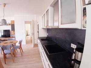 Kuchyň nebo kuchyňský kout v ubytování Ferienwohnung Haffduurn