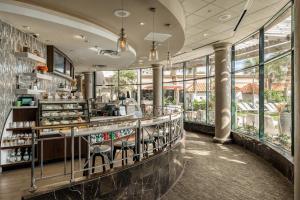 a restaurant with a counter and some windows at San Luis Resort Condos in Galveston